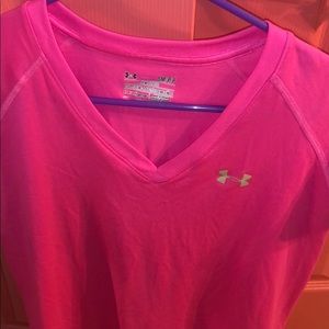 pink under armour shirt.